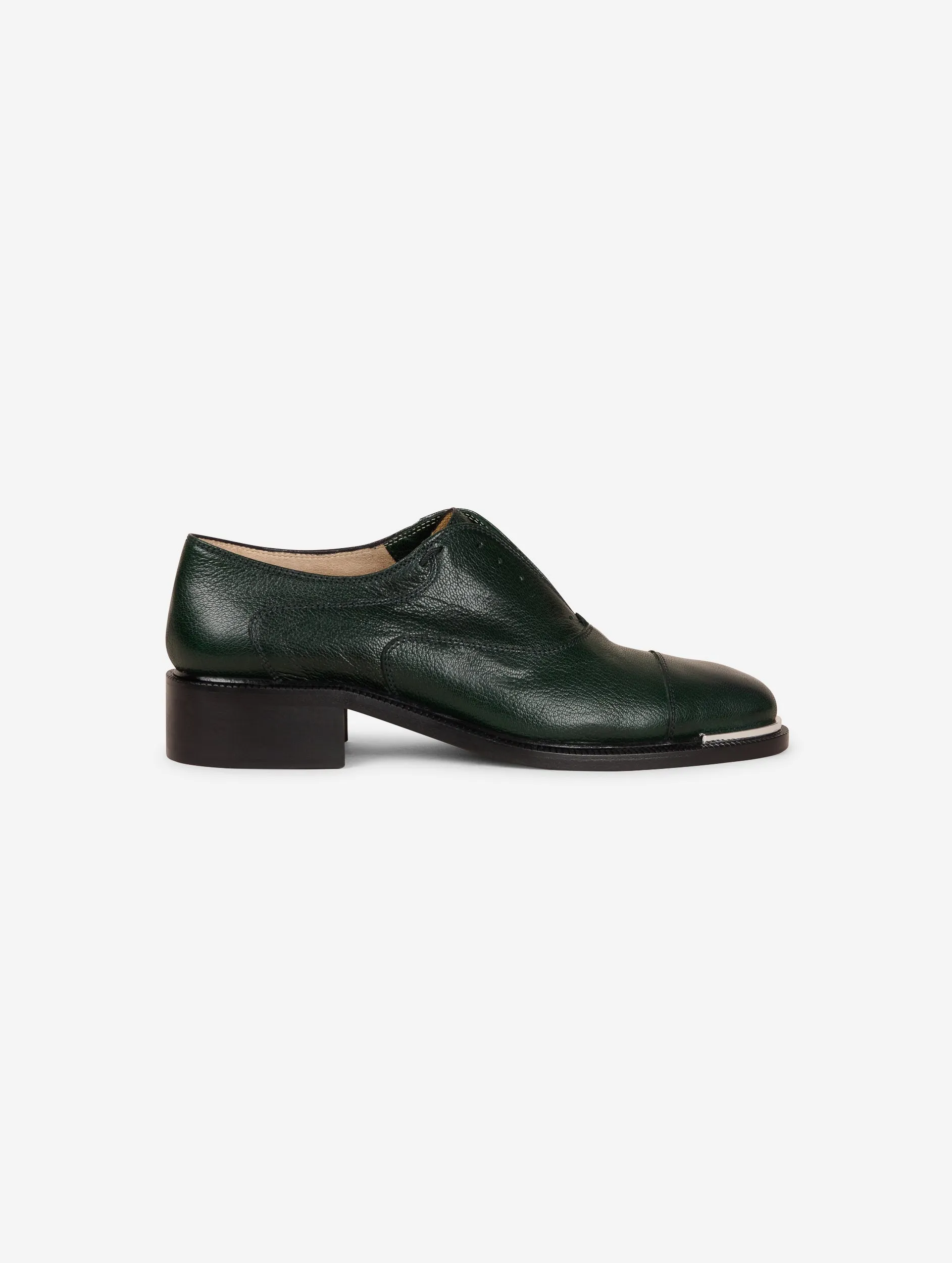 Derbies in green leather