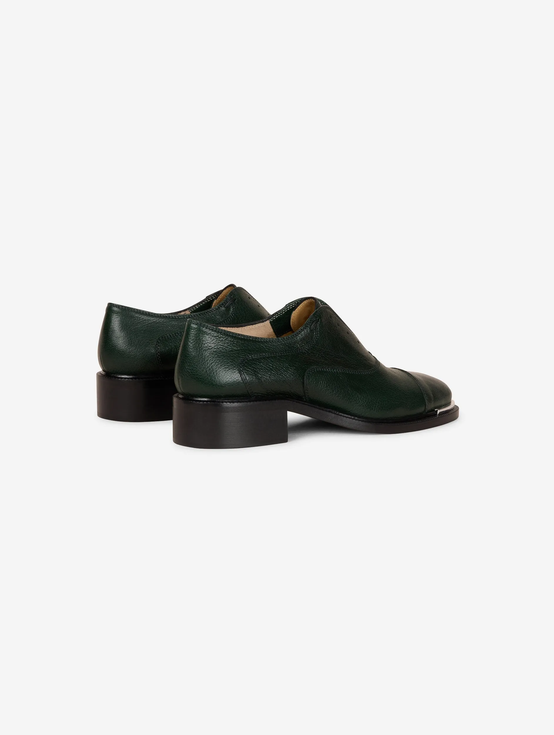 Derbies in green leather