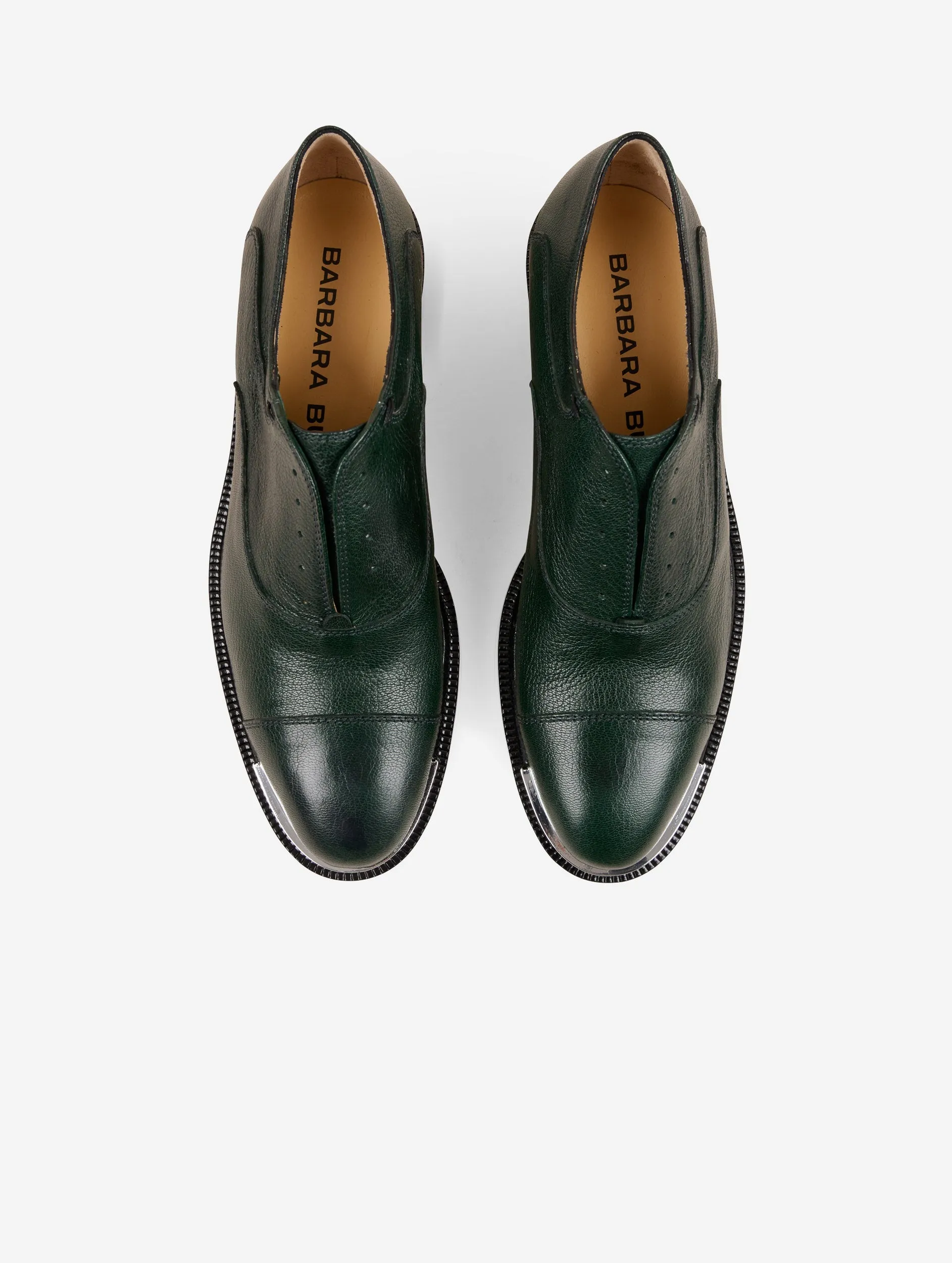 Derbies in green leather